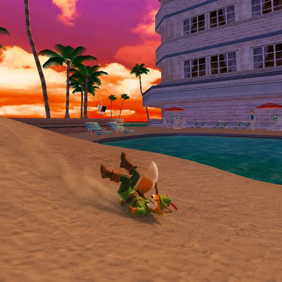 The fox rolling head over heels down a sand dune